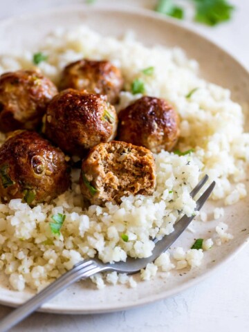 Turkey meatballs sitting on bed of rice