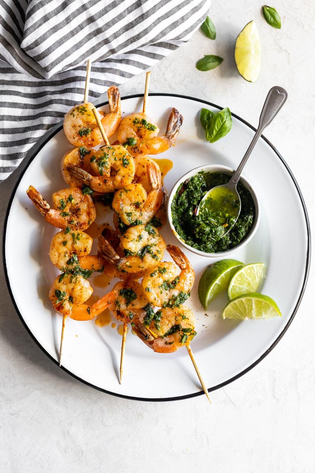Flavorful, easy-to-make shrimp skewers made with a fresh, homemade basil chimichurri. A great appetizer or main dish ready in less than 15 minutes!