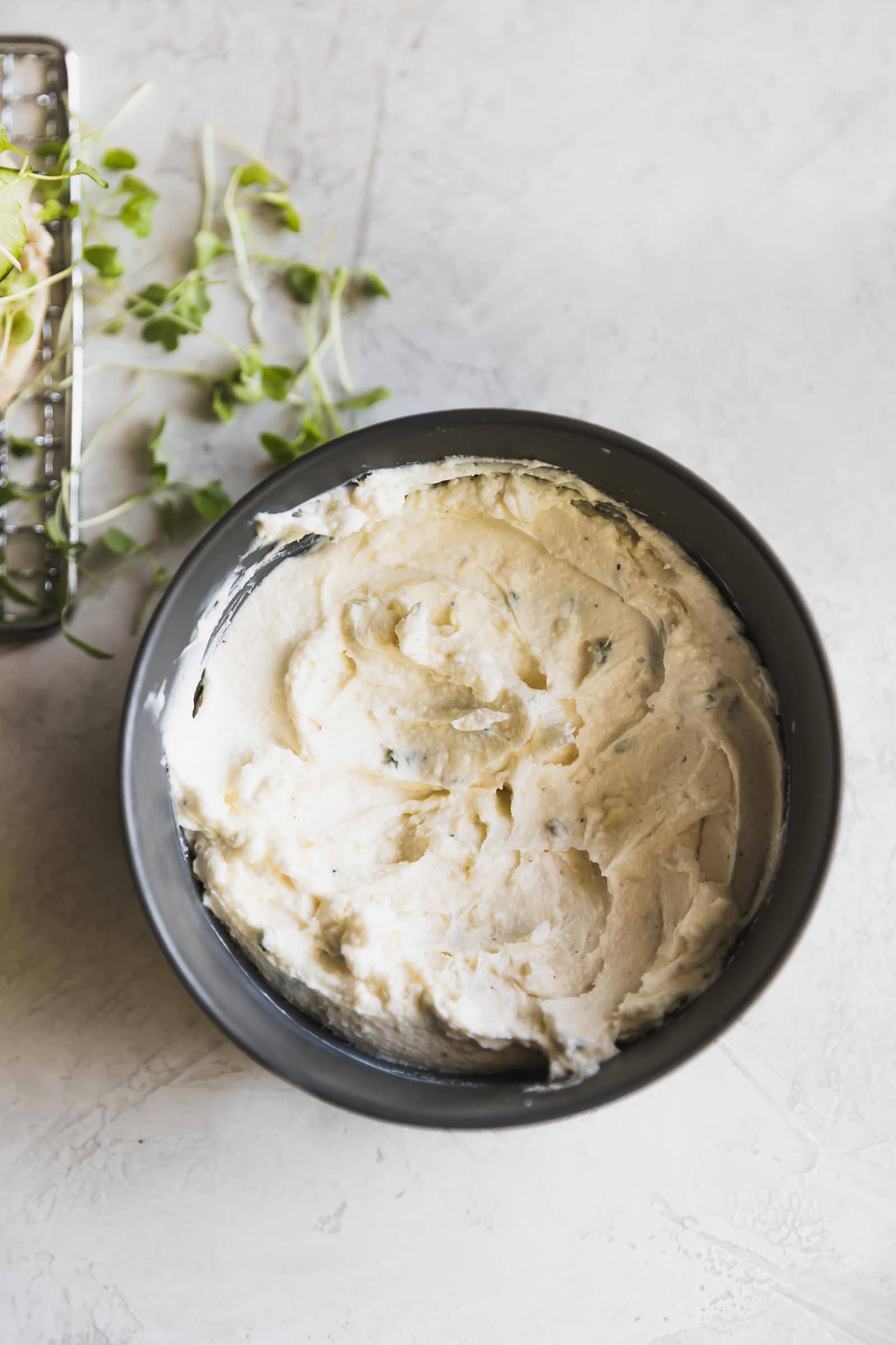 Easy-to-make, smoky, blackened salmon burgers made with smoked paprika, cayenne, brown sugar, thyme, oregano and a cool, creamy queso fresco cream cheese spread!