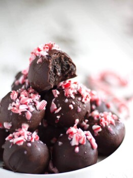 Crushed candy canes, crushed Oreo cookies, cream cheese, and melted dark chocolate result in the easiest, most refreshing, and festive dessert ever - Chocolate Peppermint Oreo Truffles!