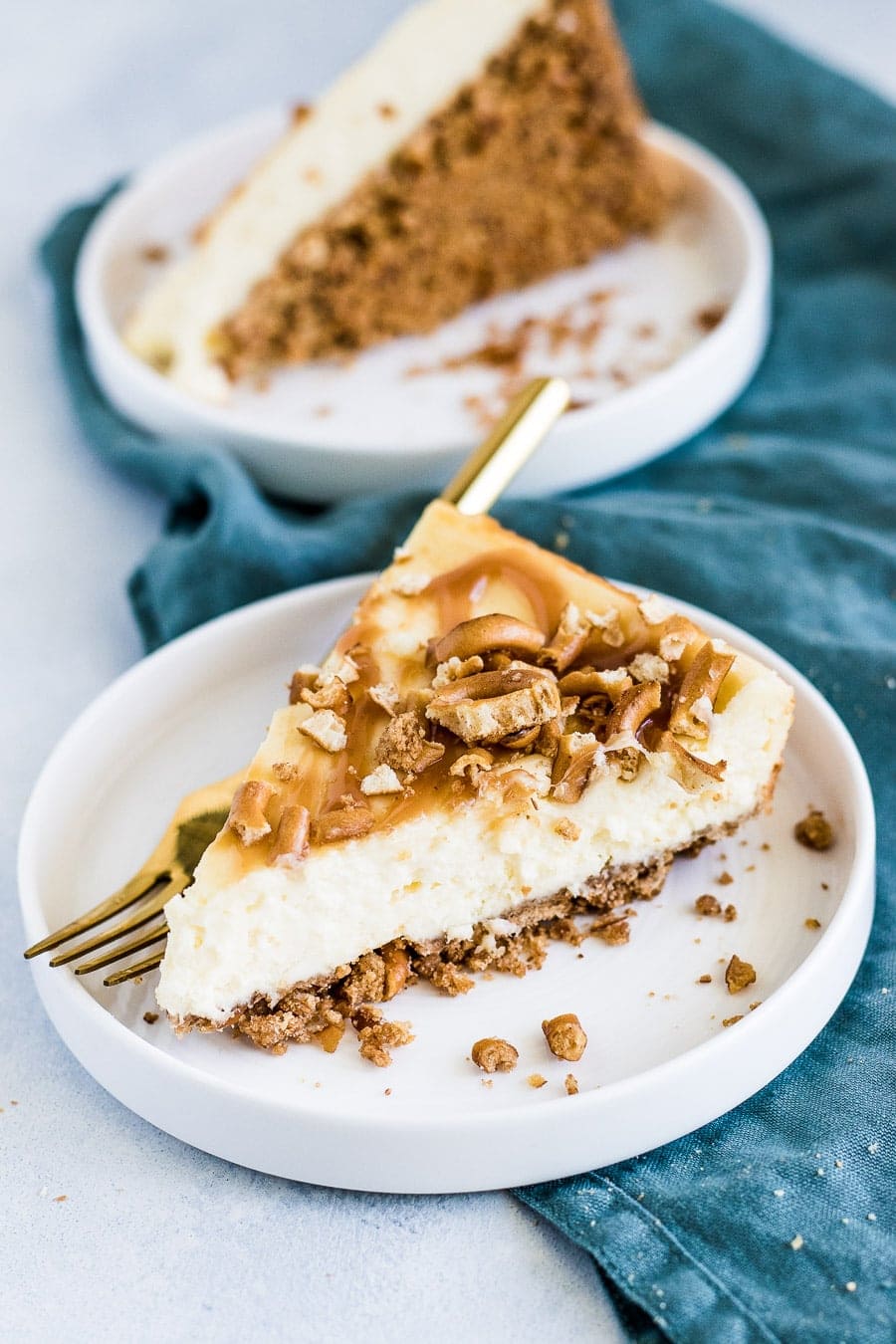 Deliciously creamy, small batch salted caramel pretzel cheesecake made with graham crackers, pretzels, and salted caramel.