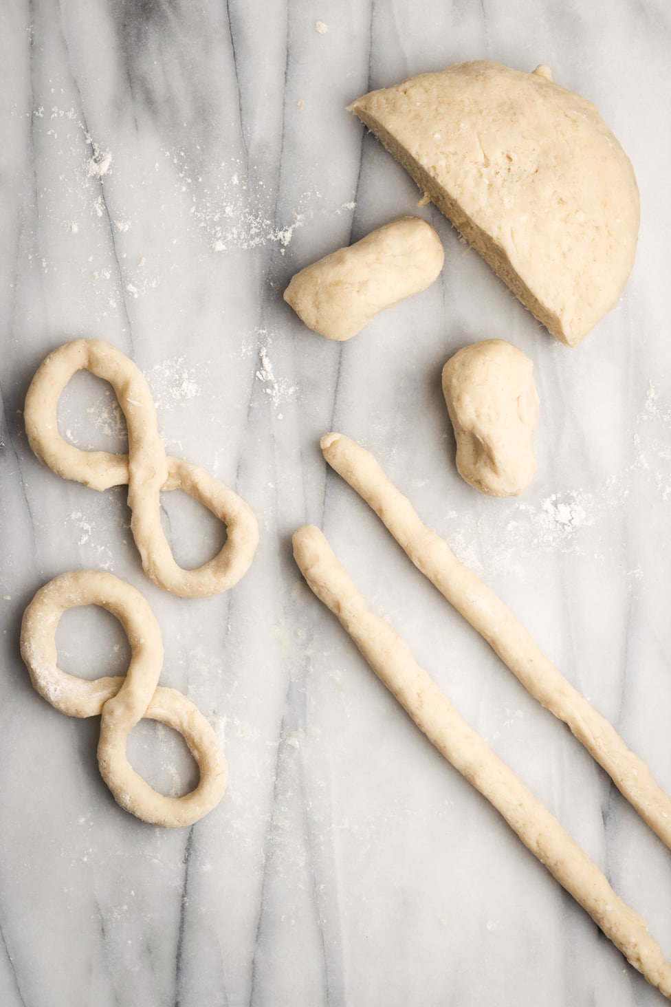 dough being formed into figure 8s