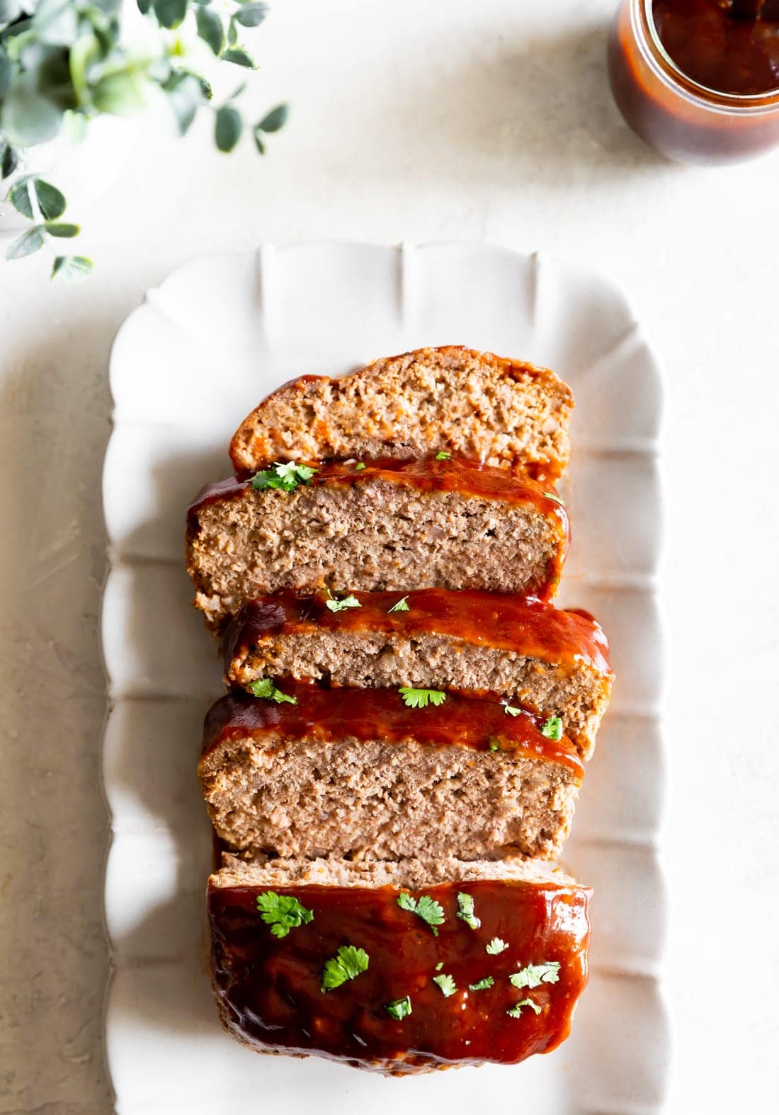 guava bbq sauce on meatloaf recipe sliced on a rectangular plate