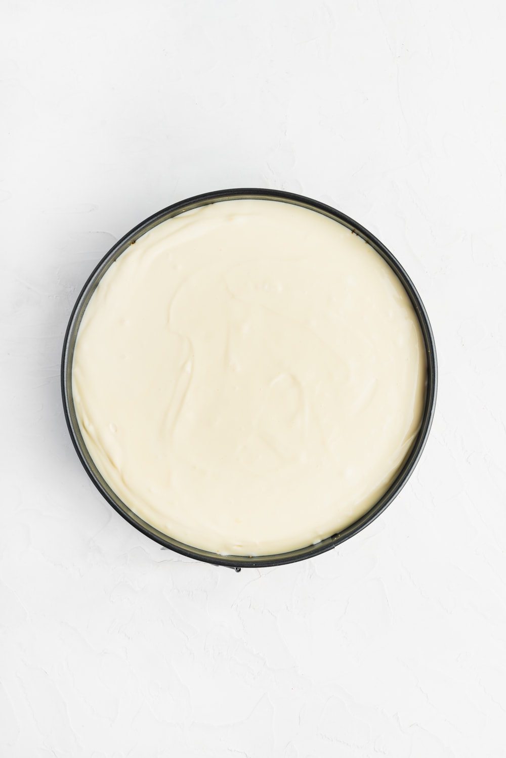 cheesecake batter in springform pan before baking