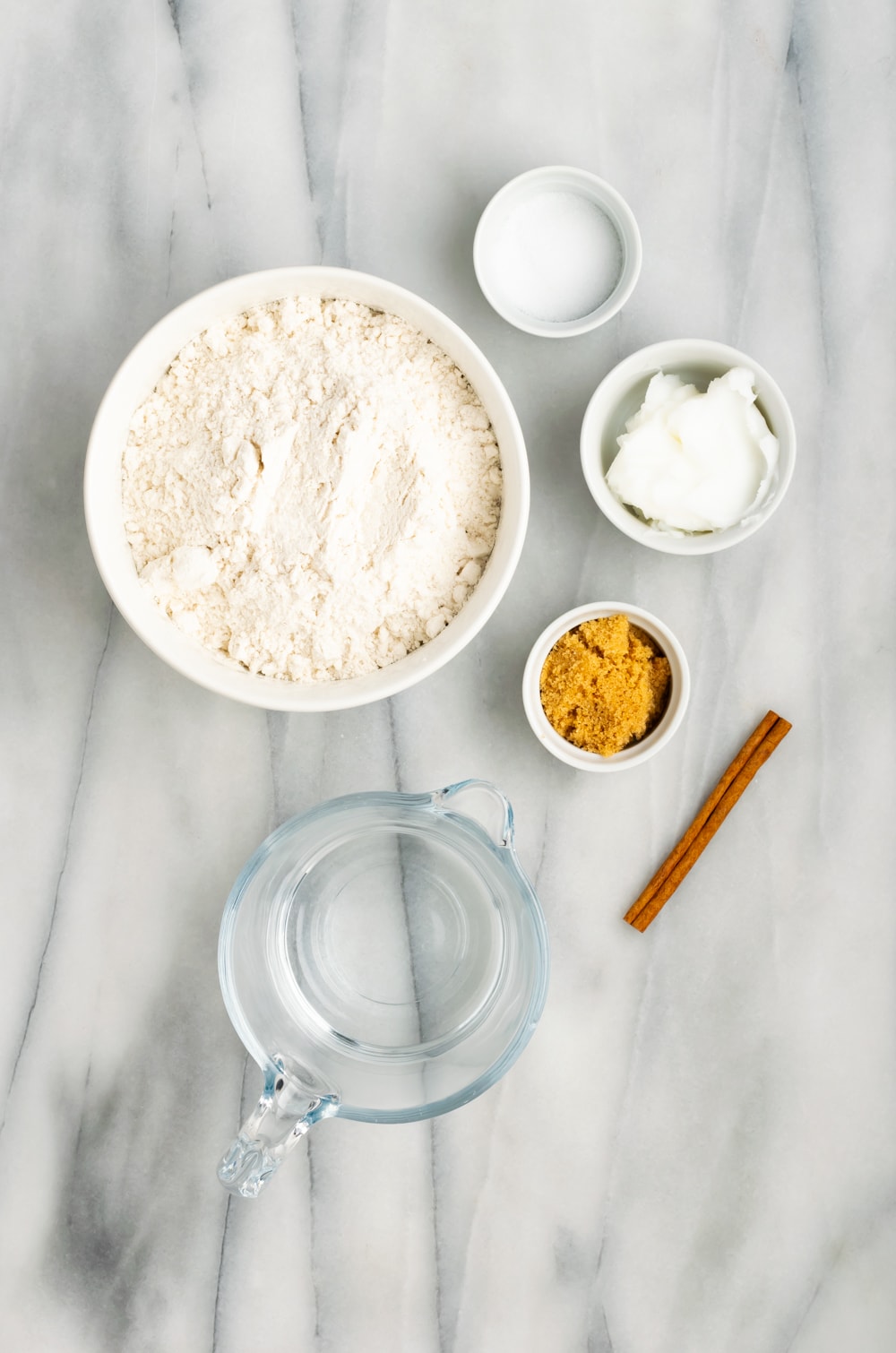 Ingredients for Cuban Empanada Dough: water, cinnamon stick, brown sugar, salt, lard, all purpose flour