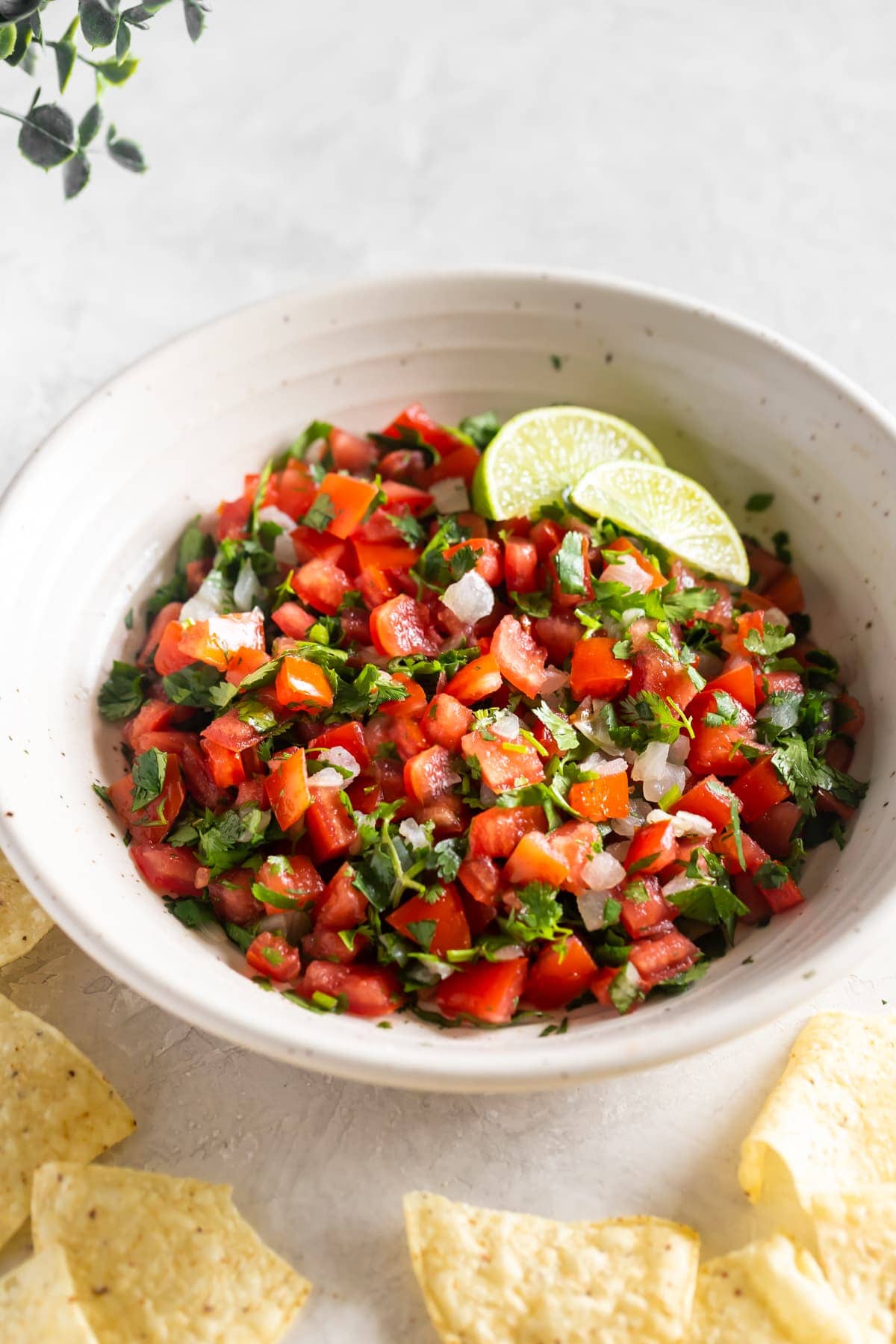 easy pico de gallo served in a bowl with tortilla chips