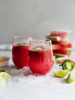 Spicy Tequila Watermelon Punch. Fresh cubed watermelon blended with tequila, lime juice, and sliced jalapeños in chili salt rimmed glasses. Refreshing drink for a hot day!
