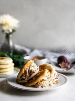 Easy-to-make arepas (pan fried corn cakes) made with homemade cranberry goat cheese and your favorite Thanksgiving leftovers!