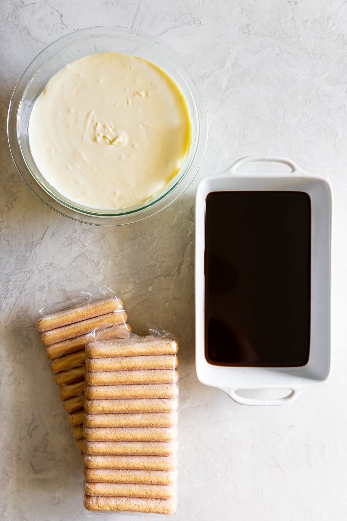 ingredients for tiramisu - espresso, ladyfingers, and mascarpone filling